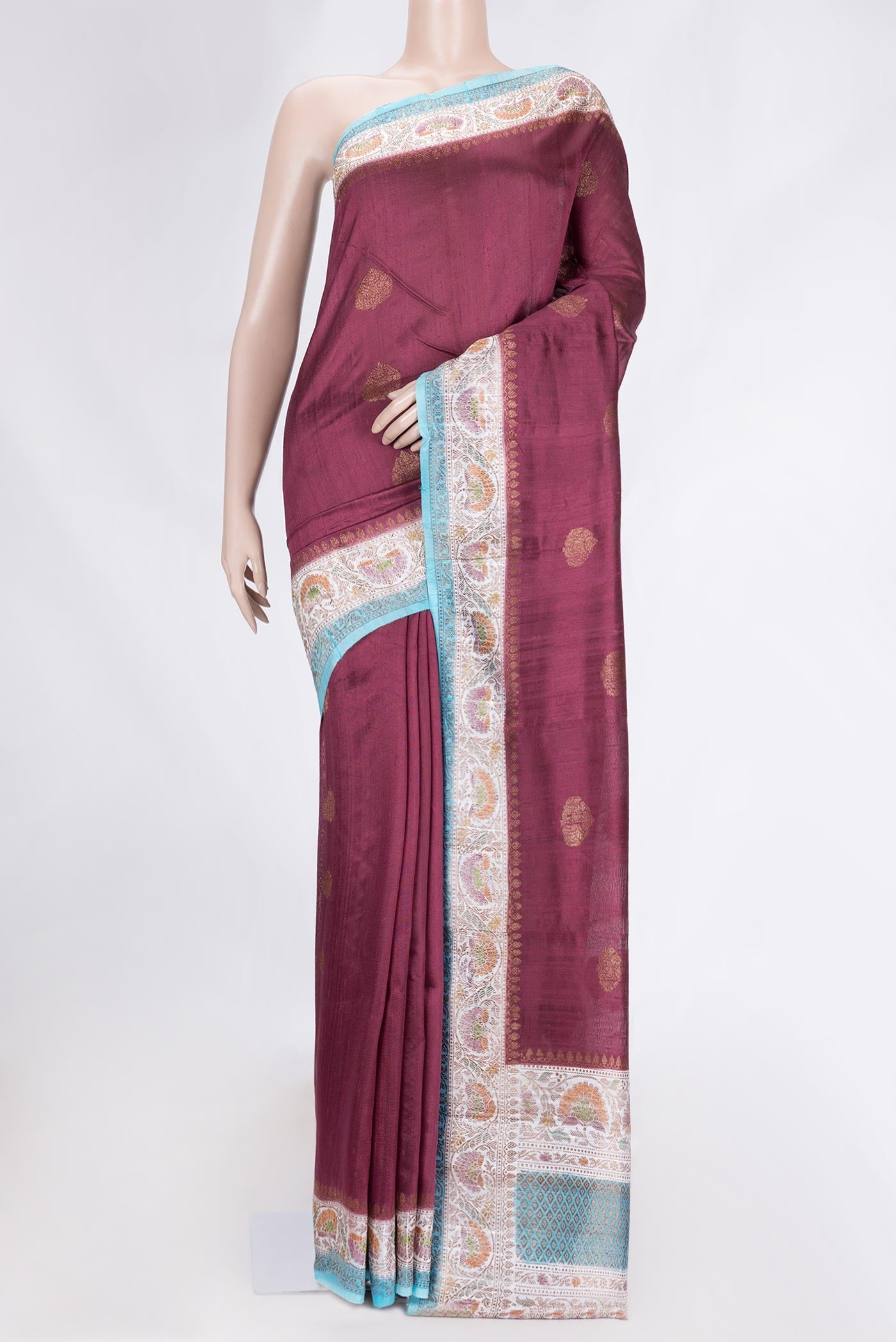 Maroon Dual Tone Tussar Saree with Zari Butta on the body and Zari Border.  displayed on a mannequin