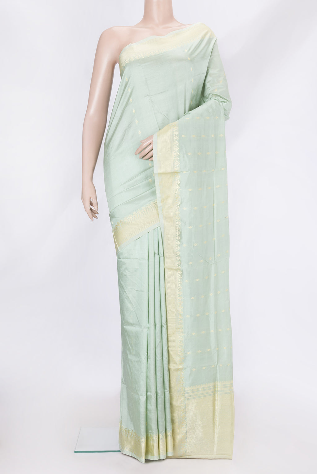 Pista Green Dual Tone Banarasi Silk Saree with Thread Butta on the body and Thread Border.  displayed on a mannequin