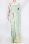 Pista Green Dual Tone Banarasi Silk Saree with Thread Butta on the body and Thread Border.  displayed on a mannequin