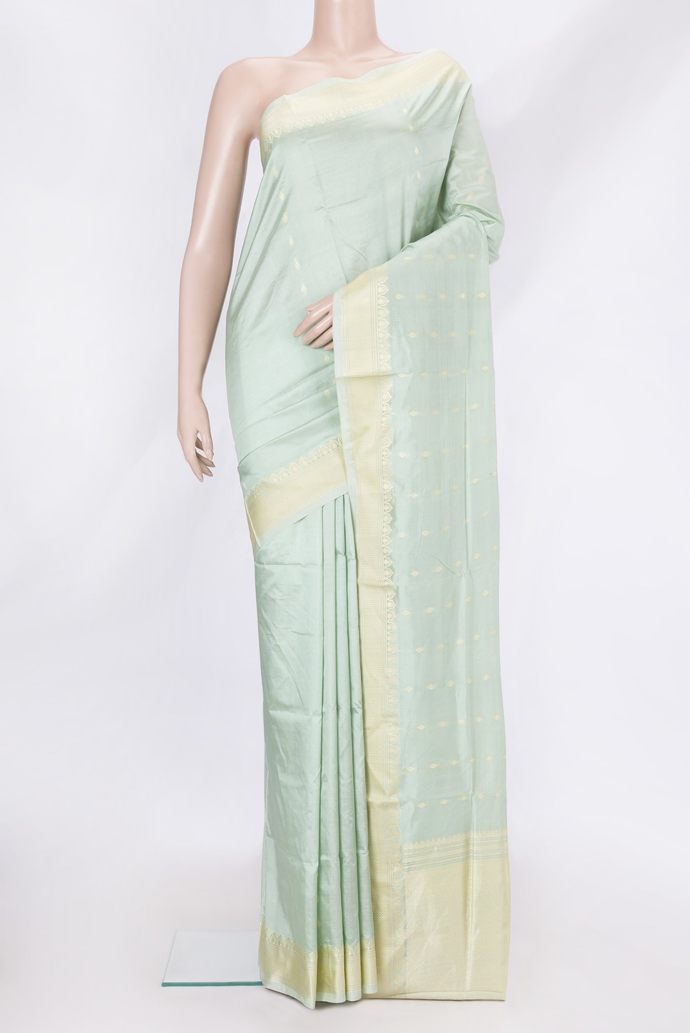 Pista Green Dual Tone Banarasi Silk Saree with Thread Butta on the body and Thread Border.  displayed on a mannequin