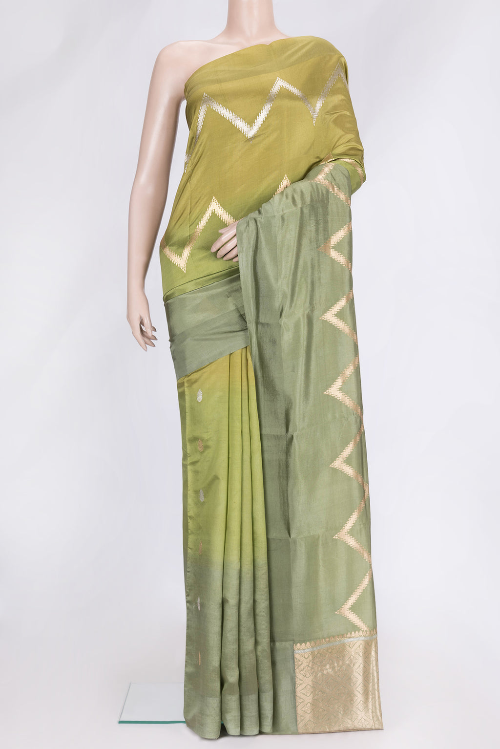 Pista Green Dual Tone Tussar Silk Saree with Zig Zag design on the body and Plain Border.  displayed on a mannequin