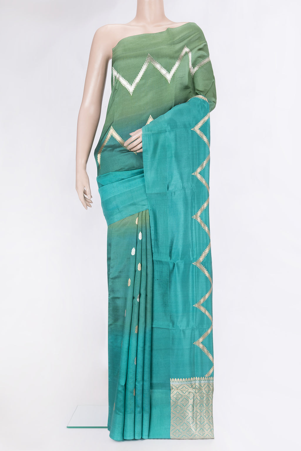 Peacock Blue Tussar Silk Saree with Stripes on the body and Plain Border.  displayed on a mannequin