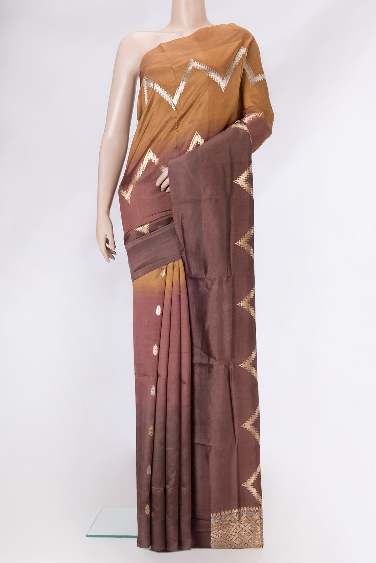 Brown Dual Tone Tussar Silk Saree with Stripes on the body and Plain Border.  displayed on a mannequin