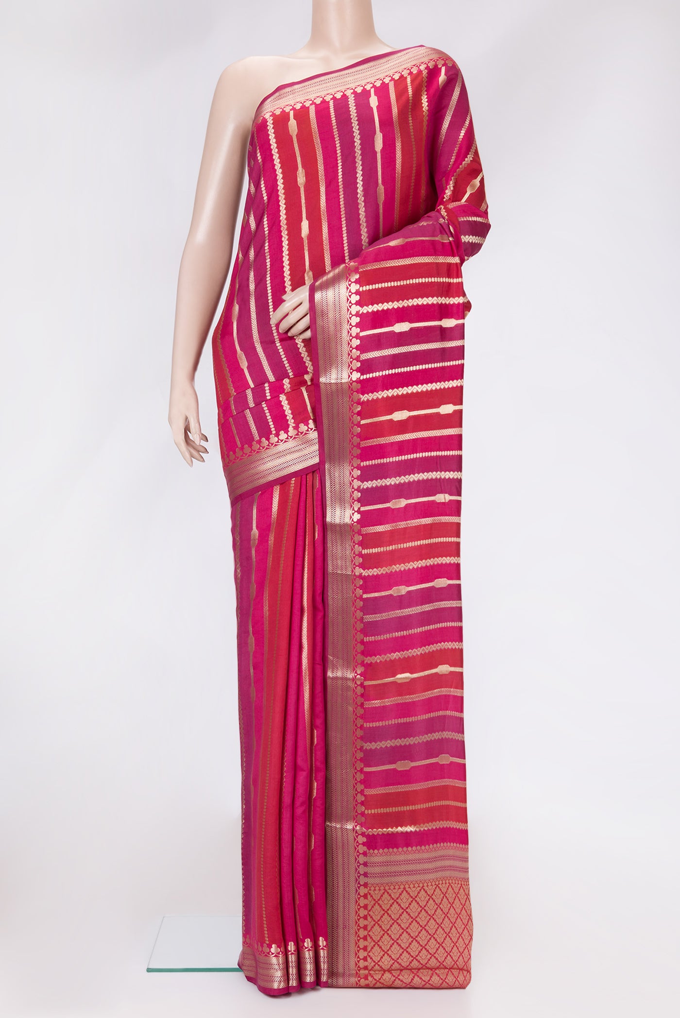 Red,Purple and Pink Color Tussar Silk Saree with Zari Brocade on the body and Zari Border.  displayed on a mannequin