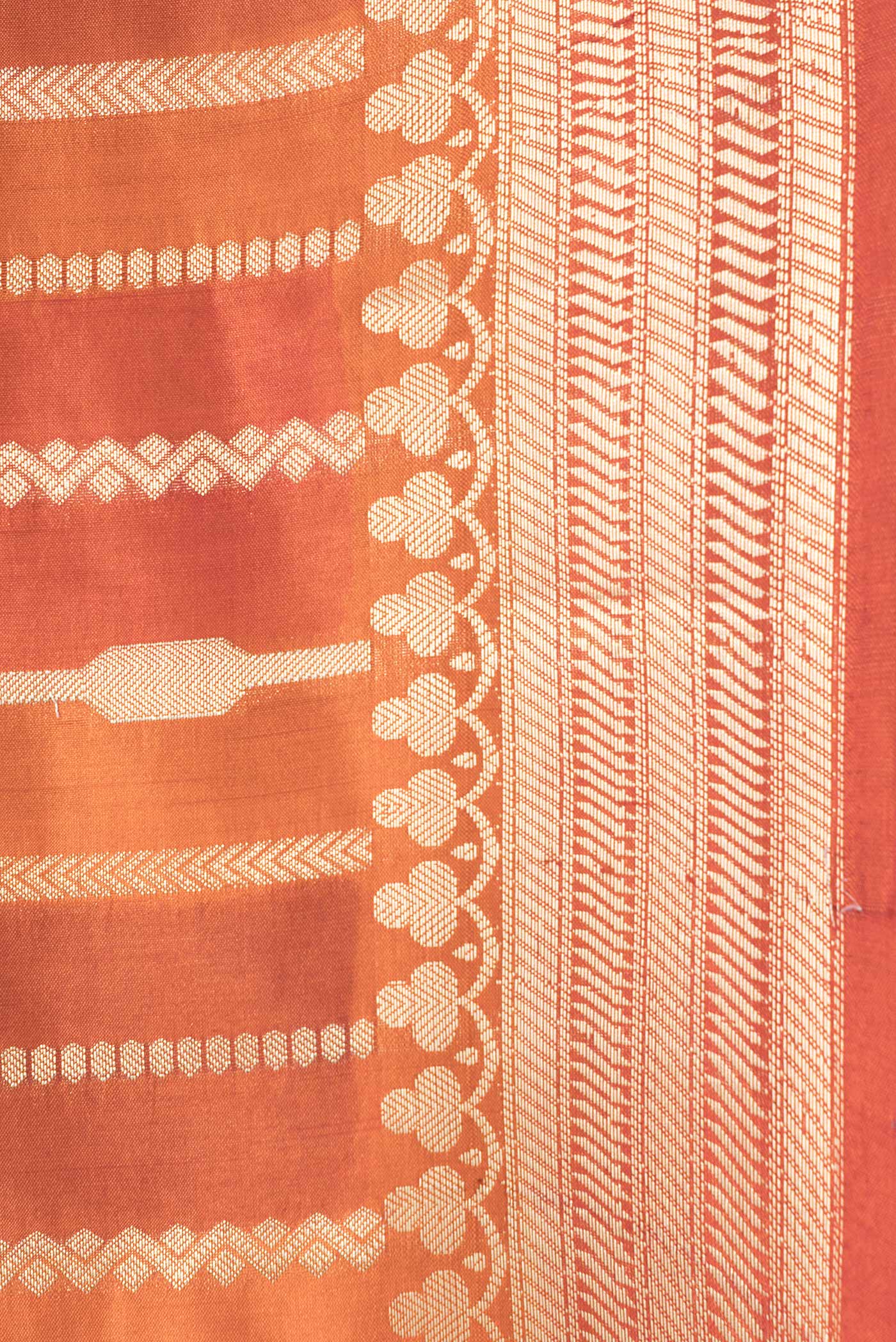 Border image of Orange Dual Tone Tussar Silk Saree with Stripes on the body and Zari Border. 