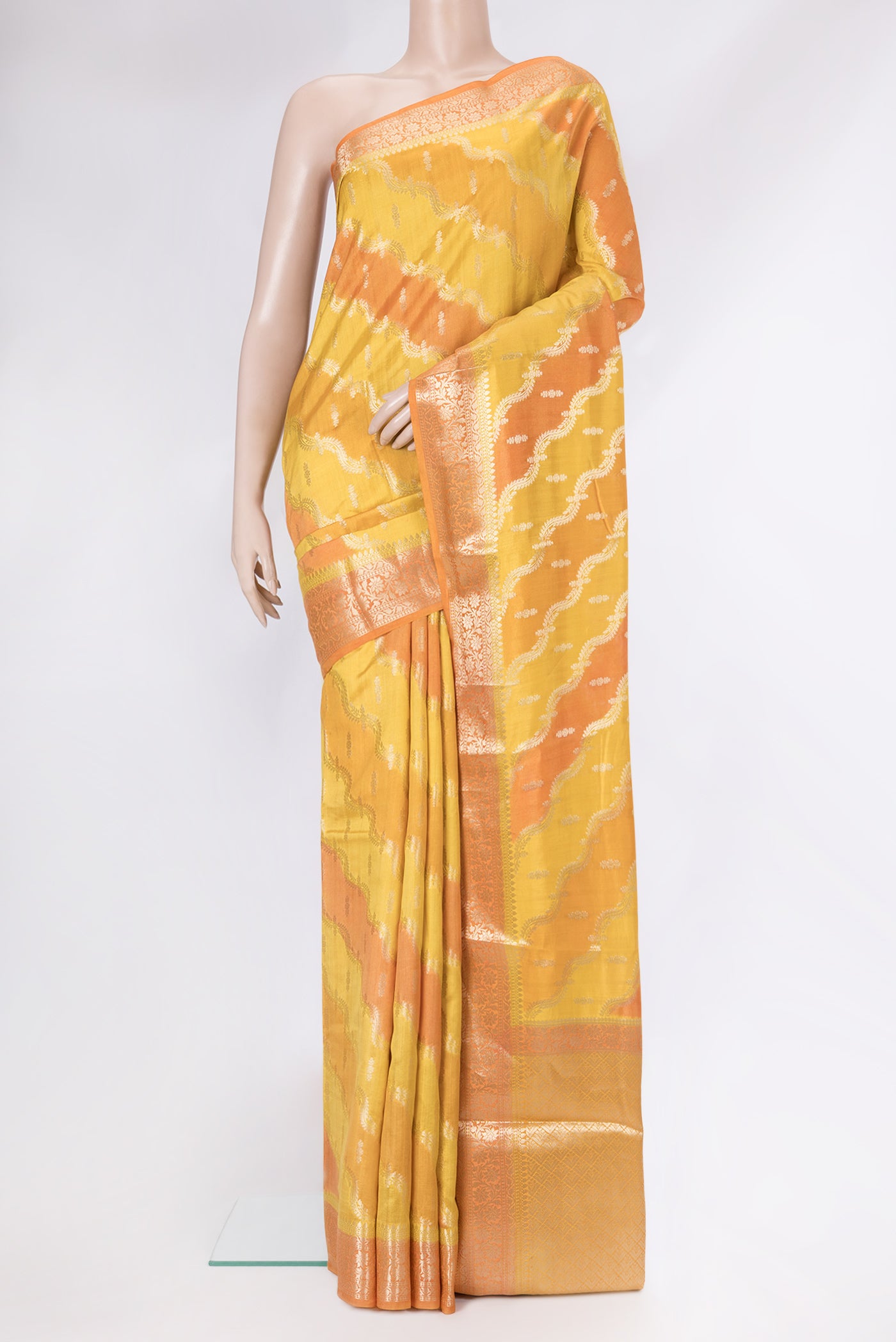 Yellow Dual Tone Banarasi Katan Silk Saree with Zari Brocade on the body and Zari Border.  displayed on a mannequin