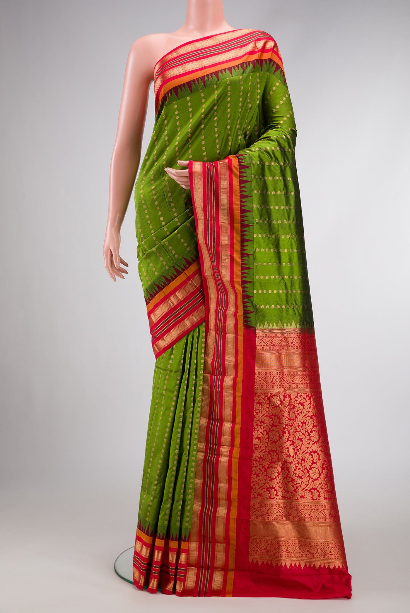 Green Dual Tone Gadwal Silk Saree with Stripes on the body and Zari Border.  displayed on a mannequin
