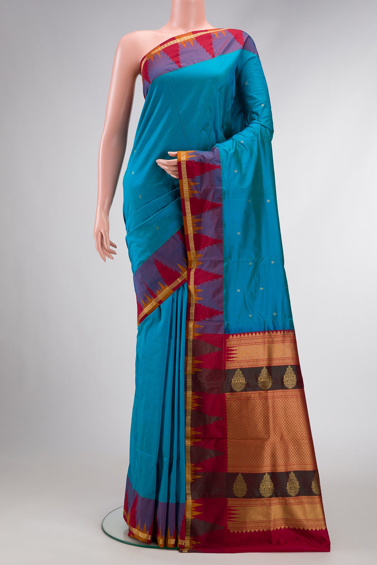 Sky Blue Dual Tone Kanchipuram Silk Saree with Zari Butta on the body and Temple Border.  displayed on a mannequin
