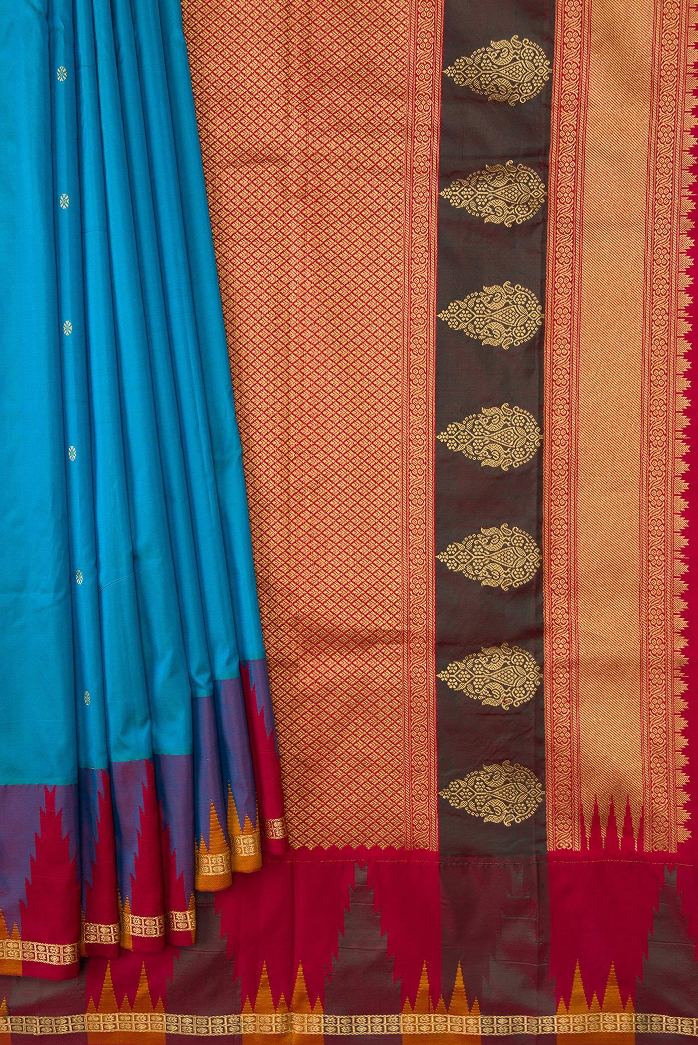 Pleats and pallu of Sky Blue Dual Tone Kanchipuram Silk Saree with Zari Butta on the body and Temple Border. 