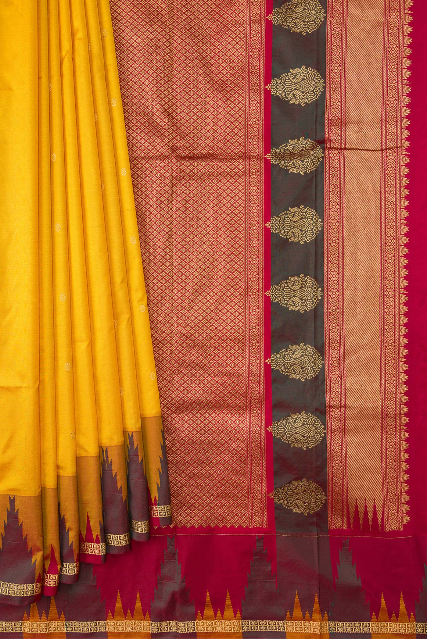 Pleats and pallu of Yellow Dual Tone Kanchipuram Silk Saree with Zari Butta on the body and Temple Border. 