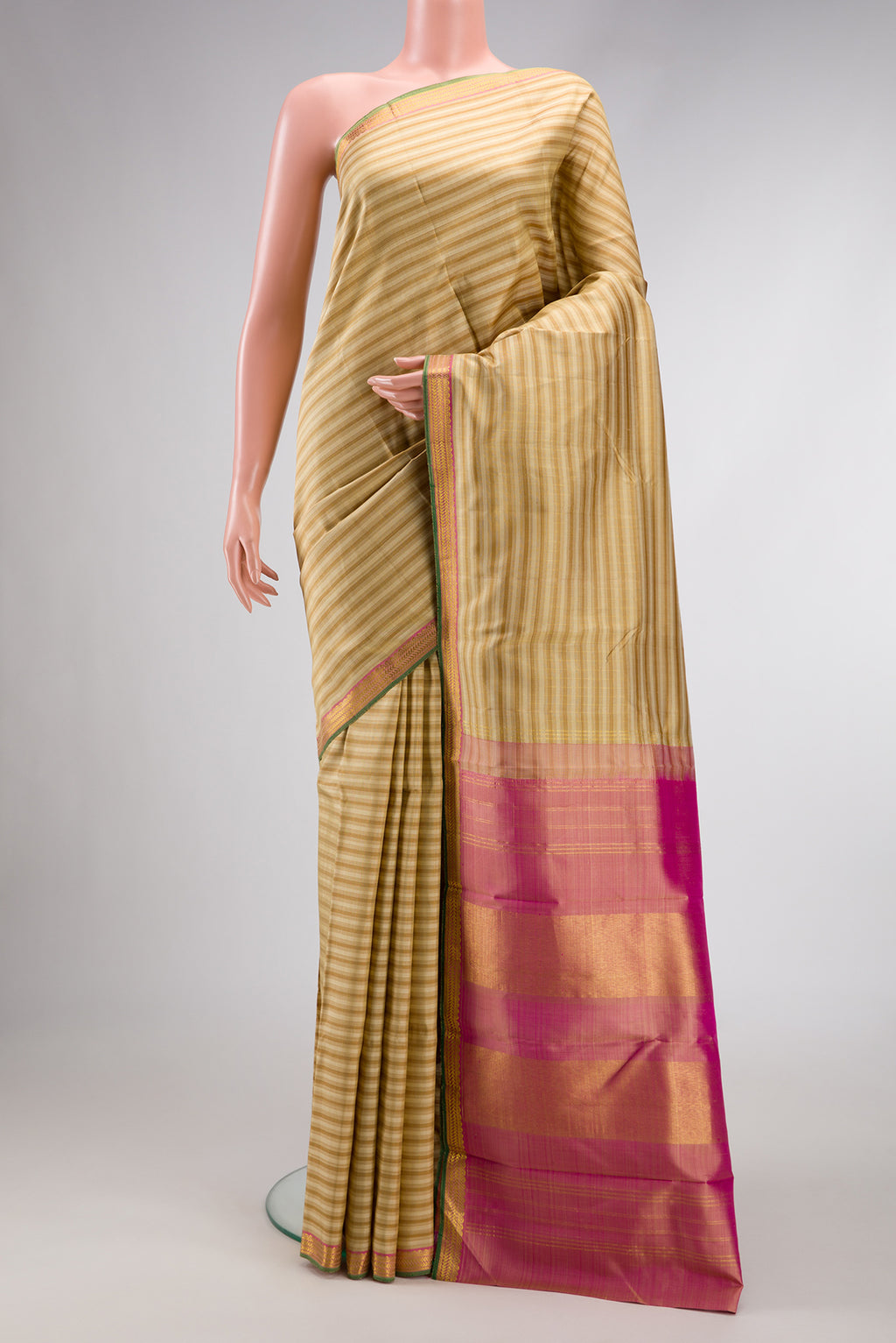 Dark Beige Dual Tone Kanchipuram Silk Saree with Checked design on the body and Zari Border.  displayed on a mannequin