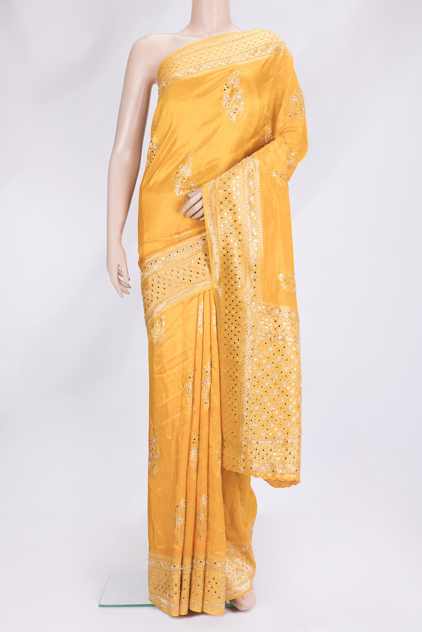 Yellow Dual Tone Mysore Georgette Saree with Embroidery on the body and Embroidery Border.  displayed on a mannequin