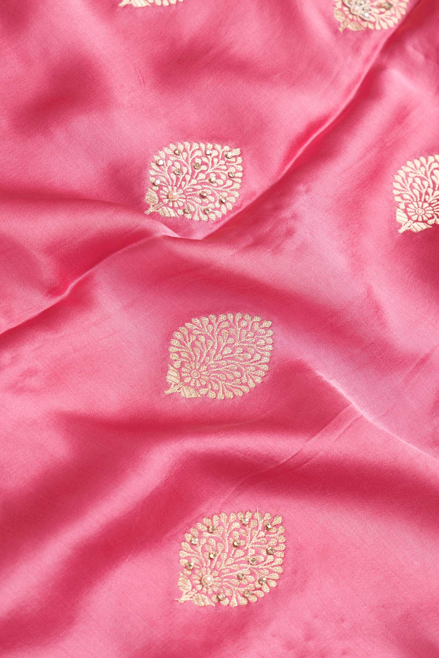 Close up of Pink Dual Tone Satin Crepe Saree with Embroidery on the body and Embroidery Border.  displaying folds