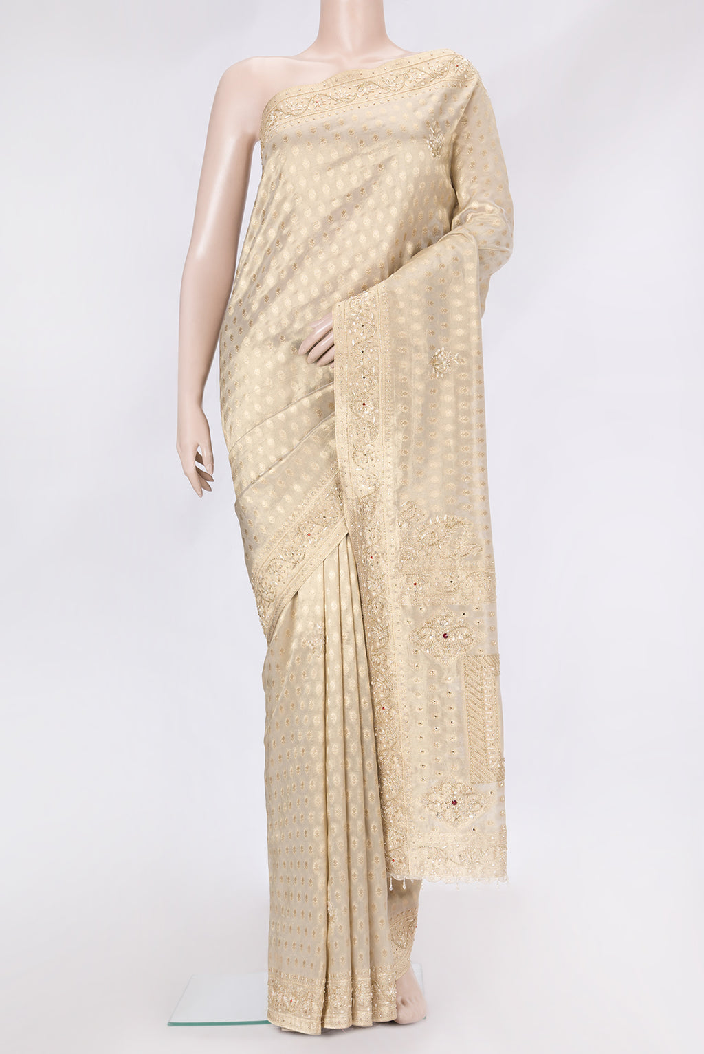 Beige Dual Tone Organza Silk Saree with Zari Brocade on the body and Embroidery Border.  displayed on a mannequin