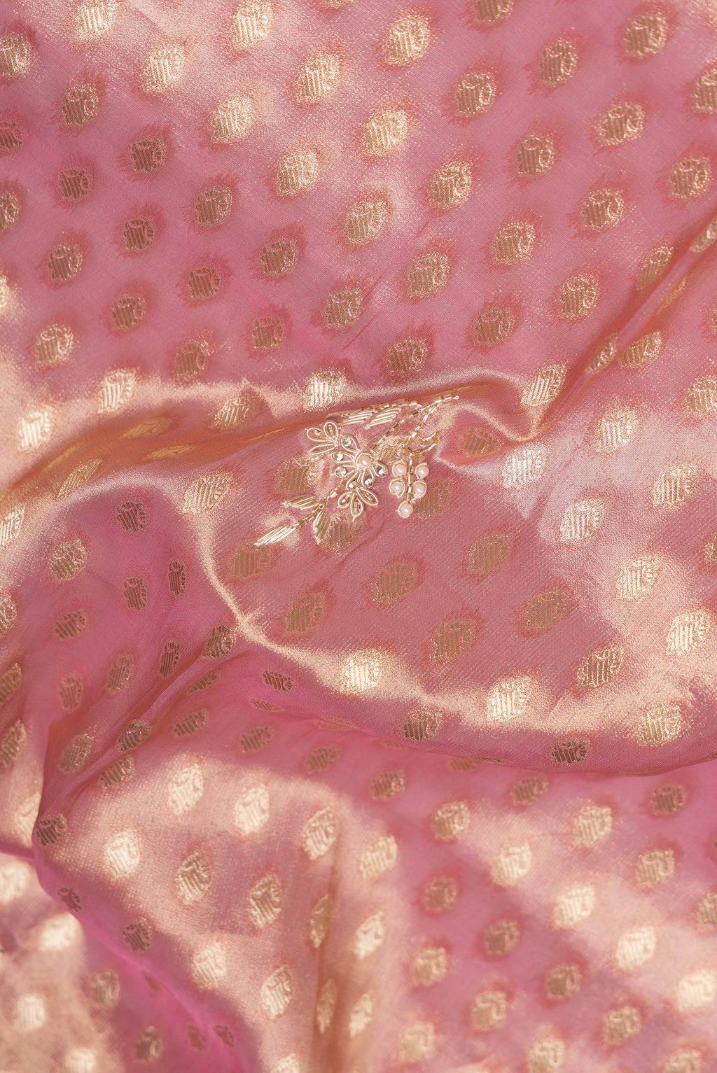 Close up of Pink Dual Tone Banarasi Georgette Saree with Embroidery on the body and Embroidery Border.  displaying folds