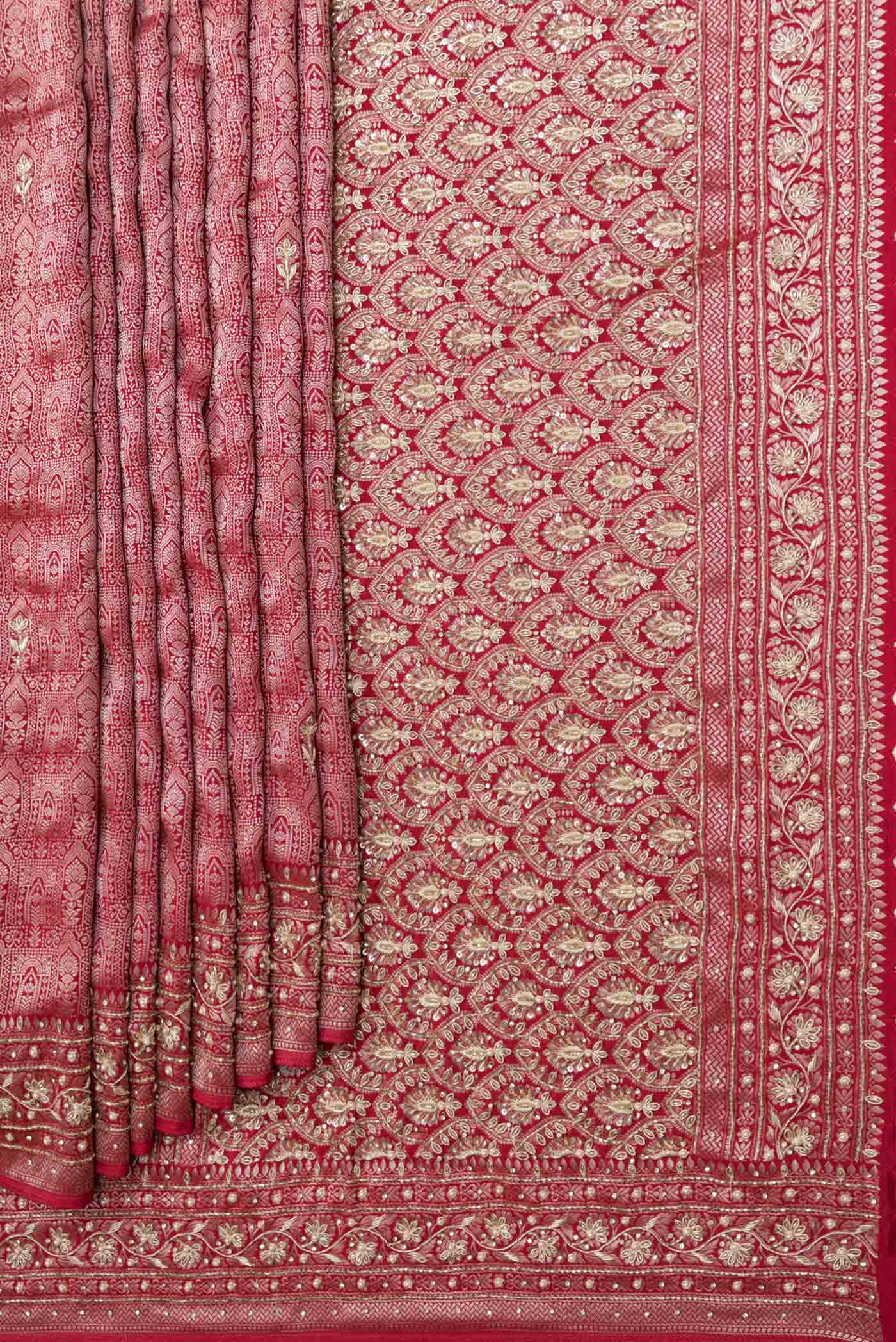 Pleats and pallu of Red Dual Tone Mysore Crepe Saree with Zari Brocade on the body and Embroidery Border. 