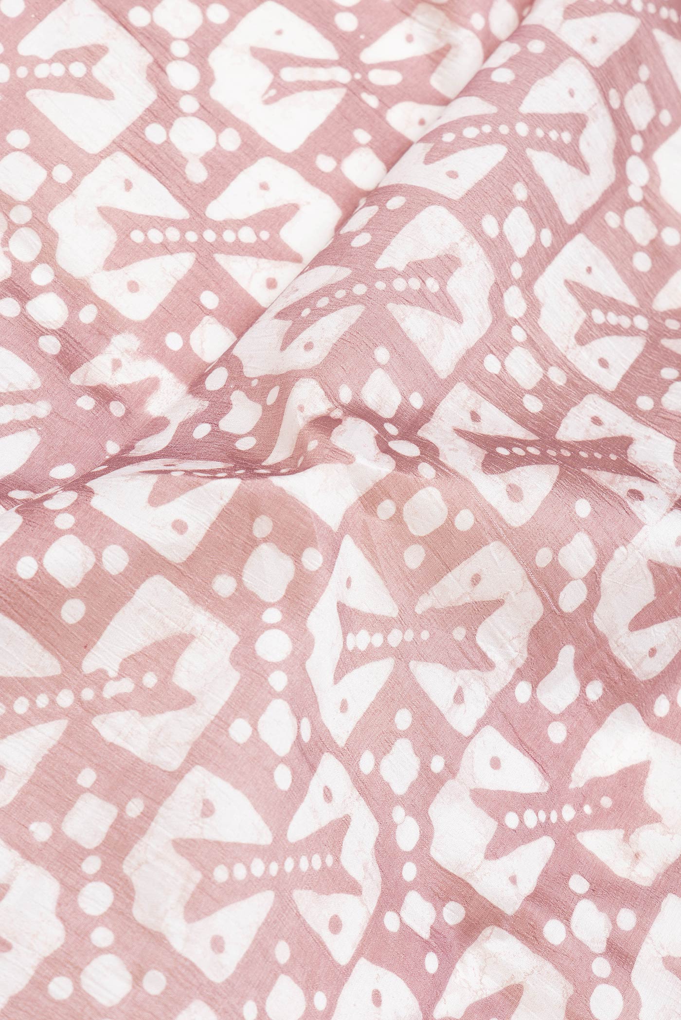 Close up of Brown Dual Tone Tussar Silk Saree with Printed design on the body and Printed Border.  displaying folds