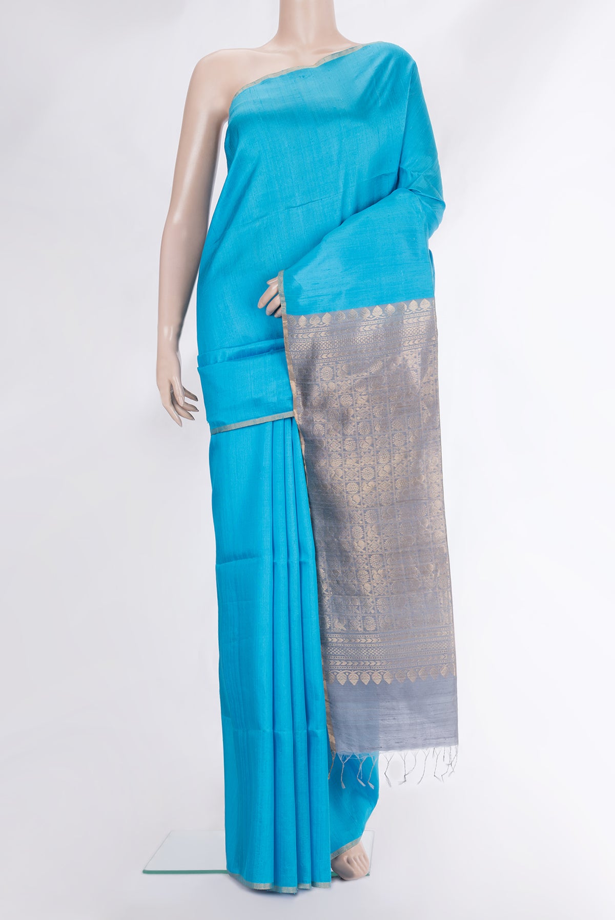 Sky Blue Dual Tone Raw Saree with Plain Body and Zari Border.  displayed on a mannequin
