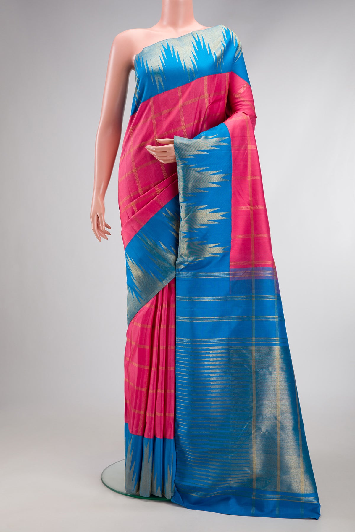 Pink Kanjivaram Silk Saree with Checked design on the body and Temple Border.  displayed on a mannequin