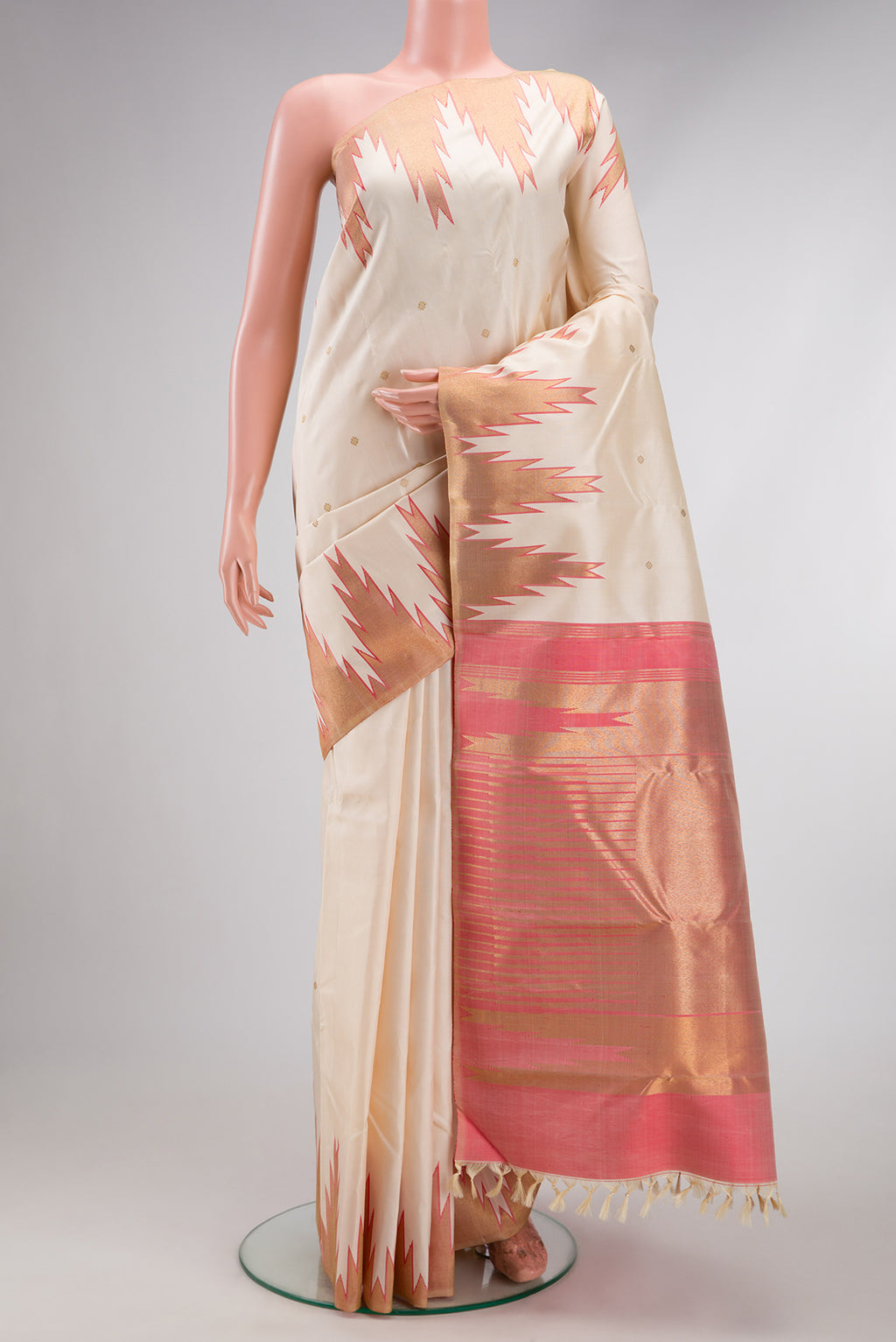 Pure Silk Pure Zari Cream Kanchipuram Saree with Zari Butta on the body and Temple Border.  displayed on a mannequin