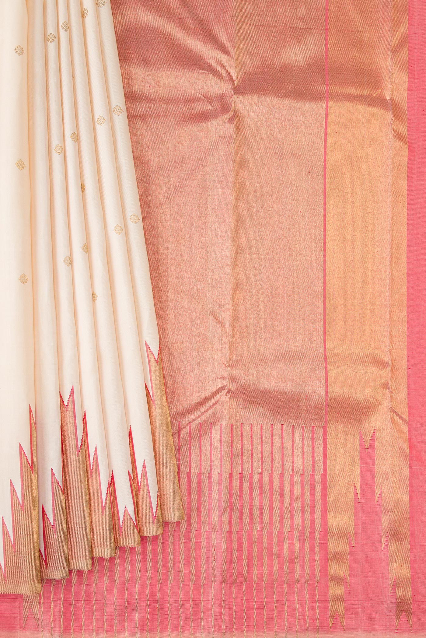 Pleats and pallu of Pure Silk Pure Zari Cream Kanchipuram Saree with Zari Butta on the body and Temple Border. 