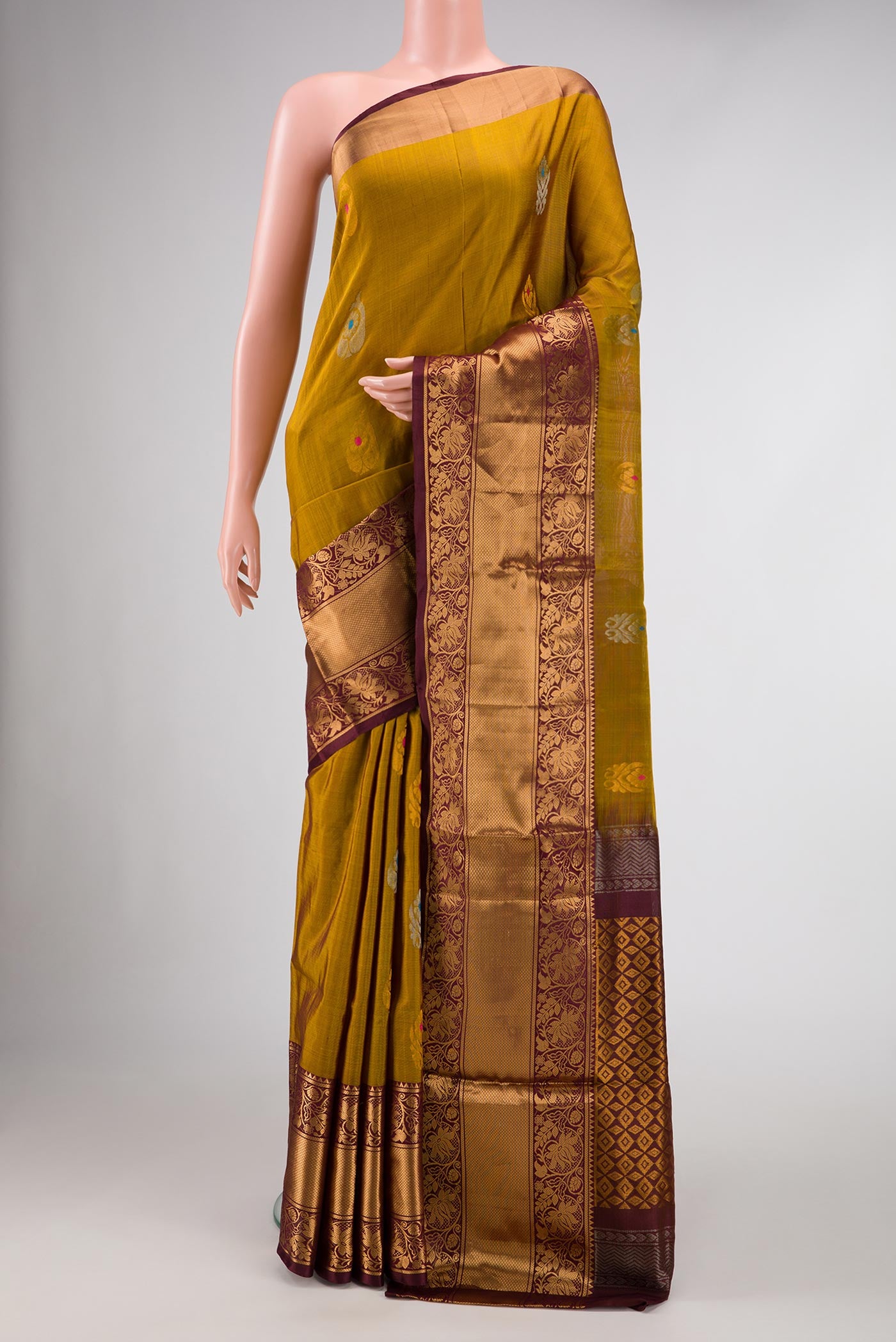Mehandi Green Dual Tone Uppada Silk Saree with Zari And Thread Butta on the body and Zari Border.  displayed on a mannequin
