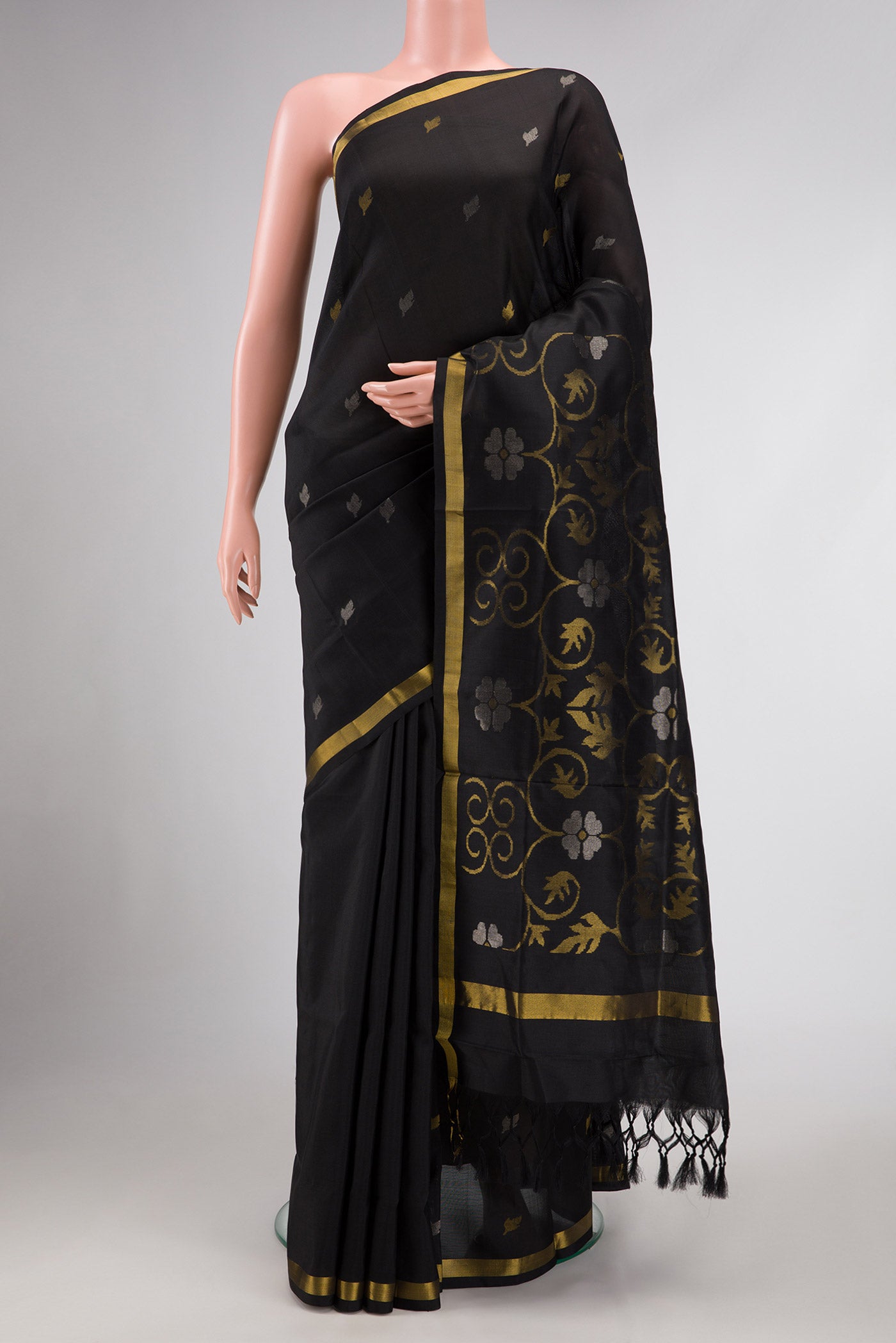 Black Dual Tone Uppada Silk Saree with Zari Butta on the body and Zari Border.  displayed on a mannequin