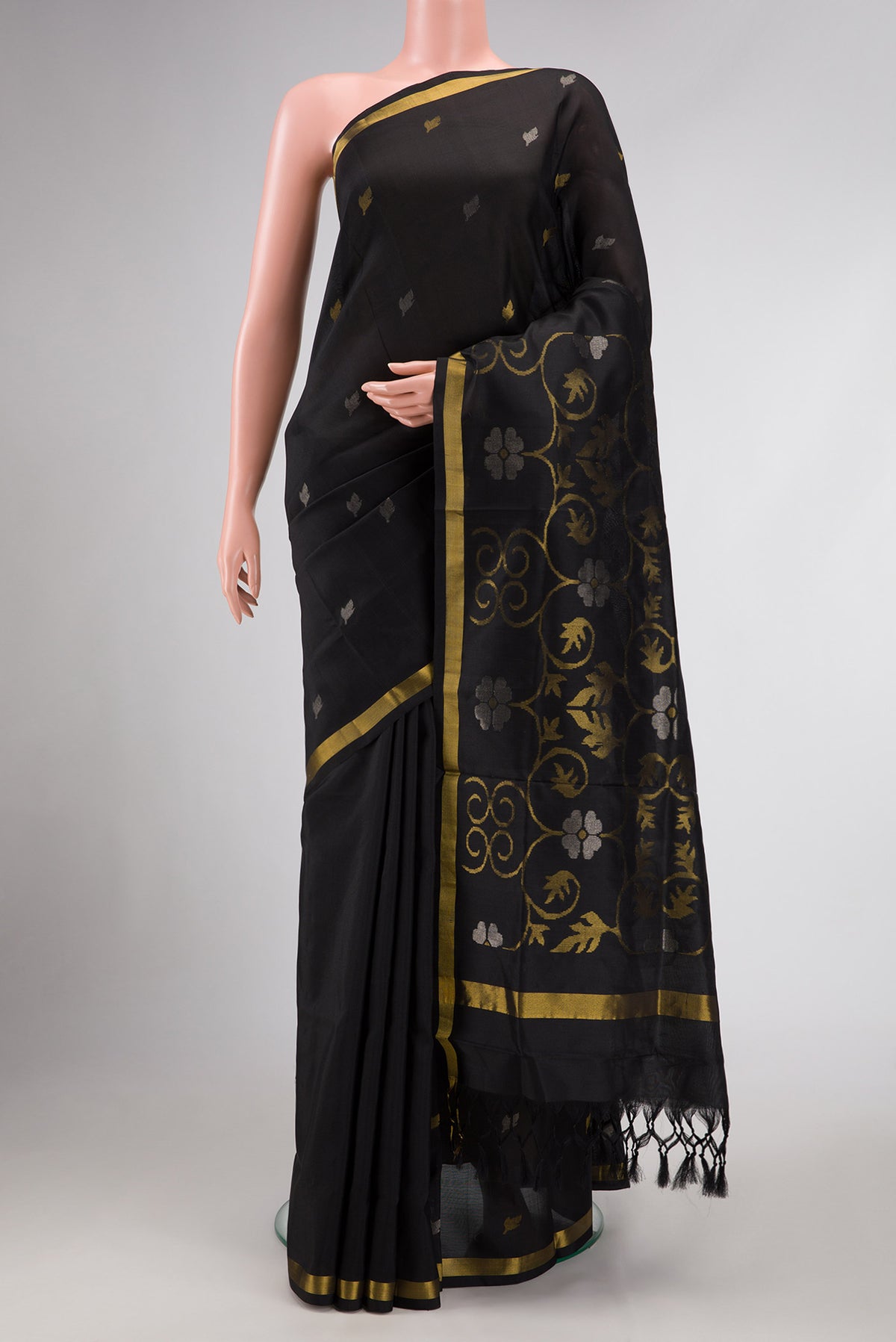 Black Dual Tone Uppada Silk Saree with Zari Butta on the body and Zari Border.  displayed on a mannequin