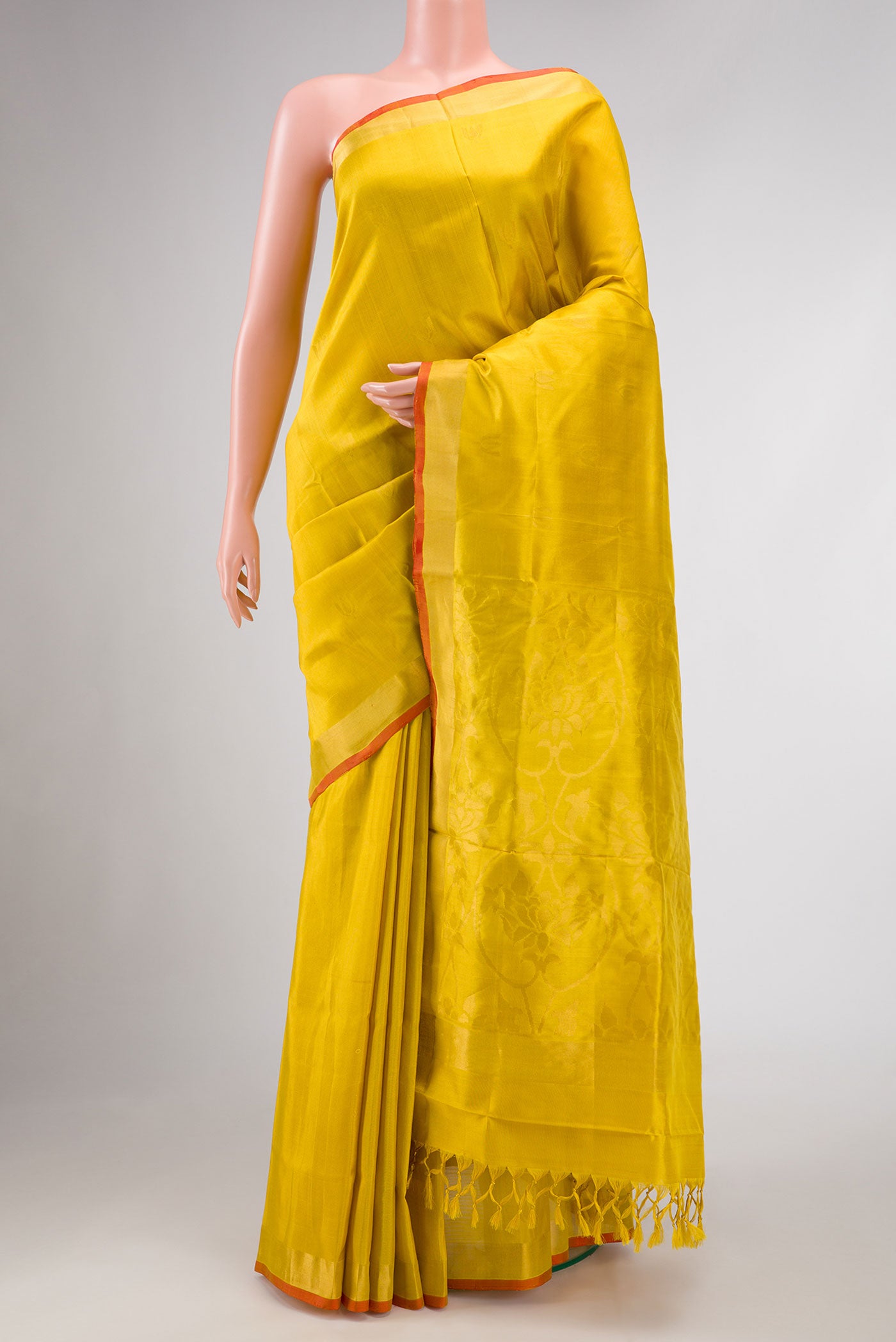 Mustard Dual Tone Uppada Silk Saree with Zari Butta on the body and Zari Border.  displayed on a mannequin