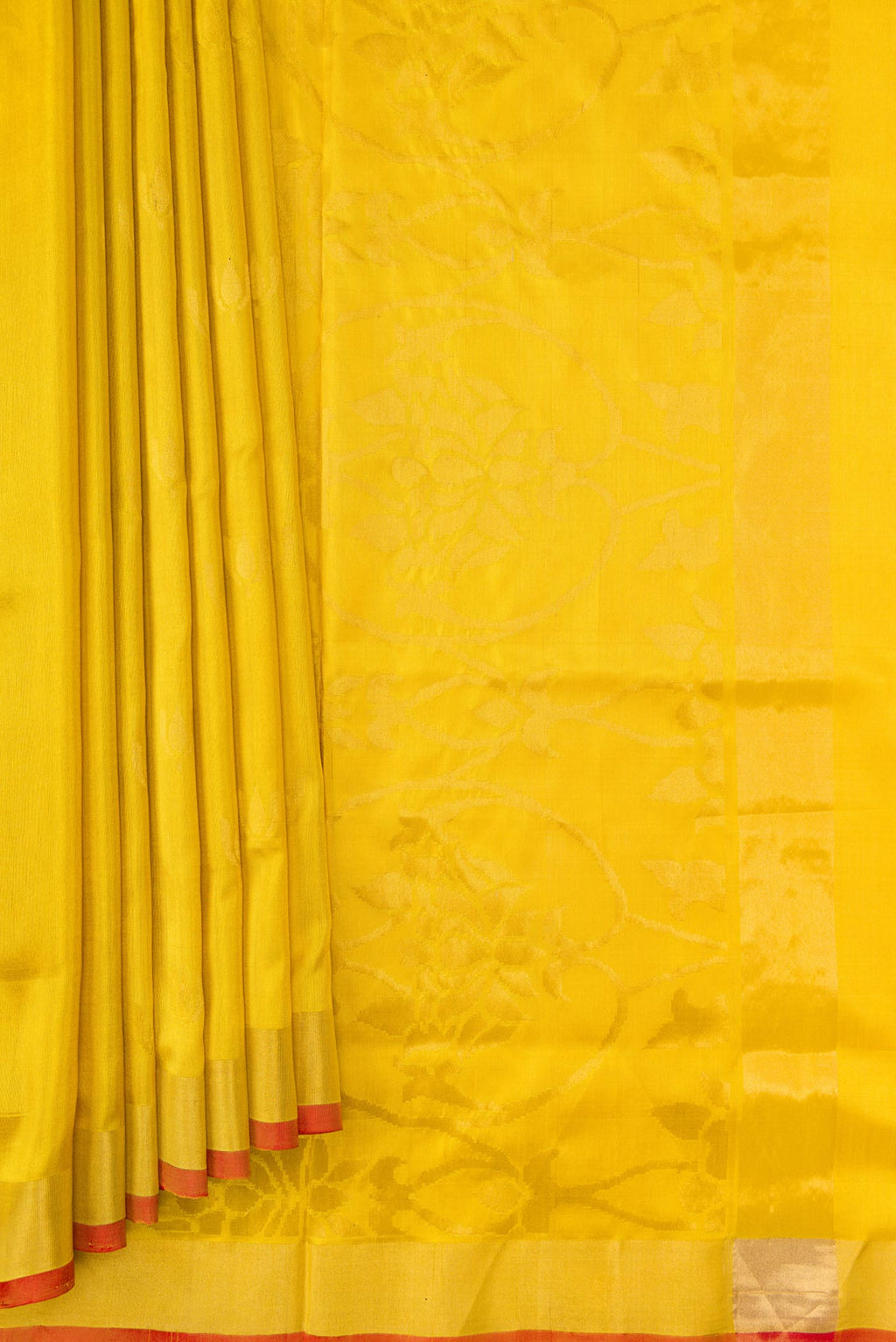 Pleats and pallu of Mustard Dual Tone Uppada Silk Saree with Zari Butta on the body and Zari Border. 