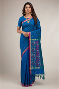 Model wearing a Peacock Blue Dual Tone Uppada Silk Saree with Zari And Thread Butta on the body and Zari Border.