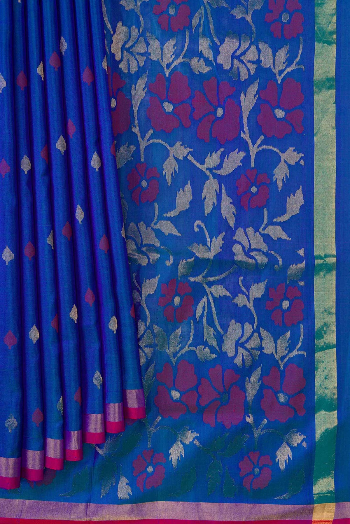 Pleats and pallu of Peacock Blue Dual Tone Uppada Silk Saree with Zari And Thread Butta on the body and Zari Border. 