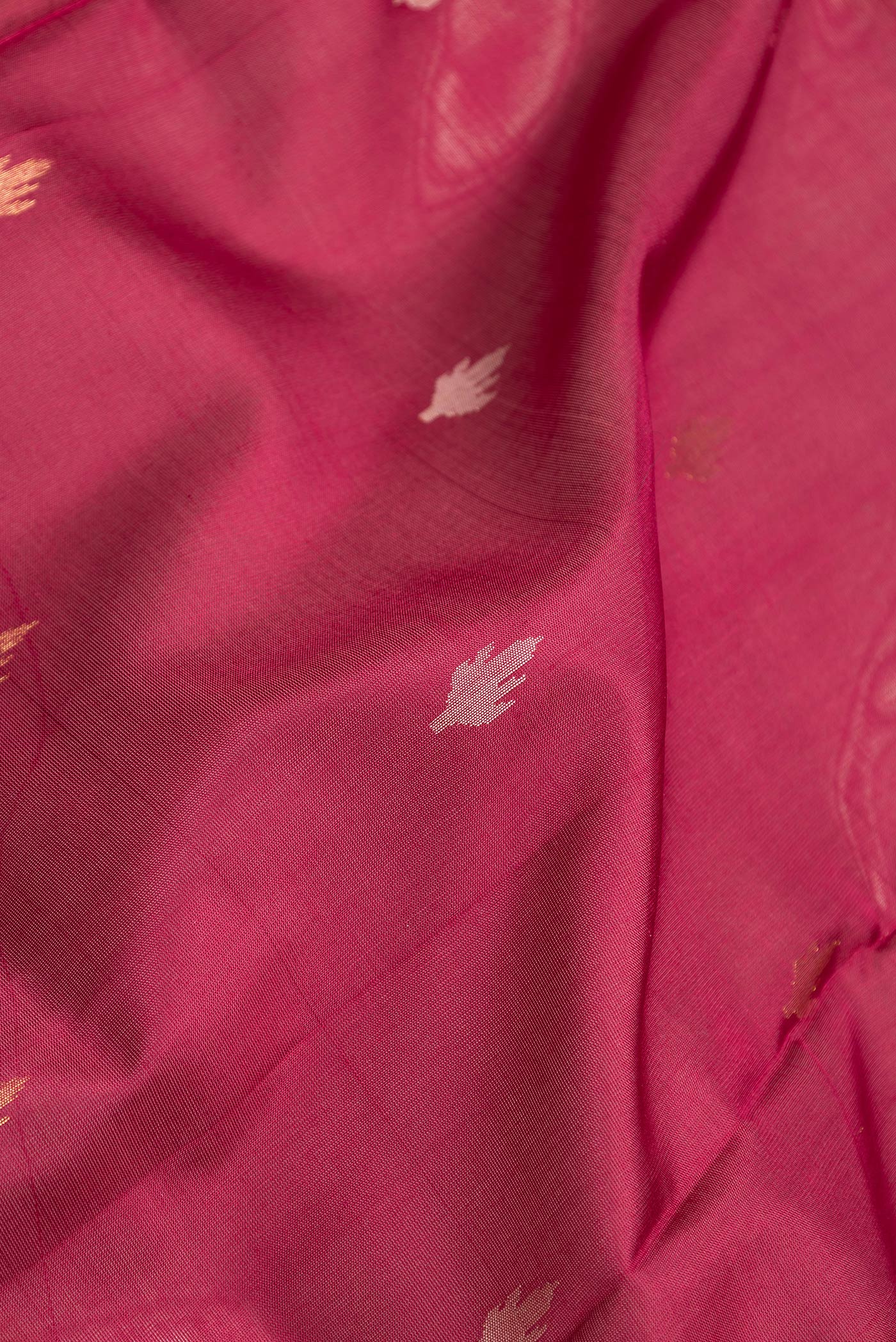 Close up of Maroon Dual Tone Uppada Silk Saree with Zari Butta on the body and Zari Border.  displaying folds
