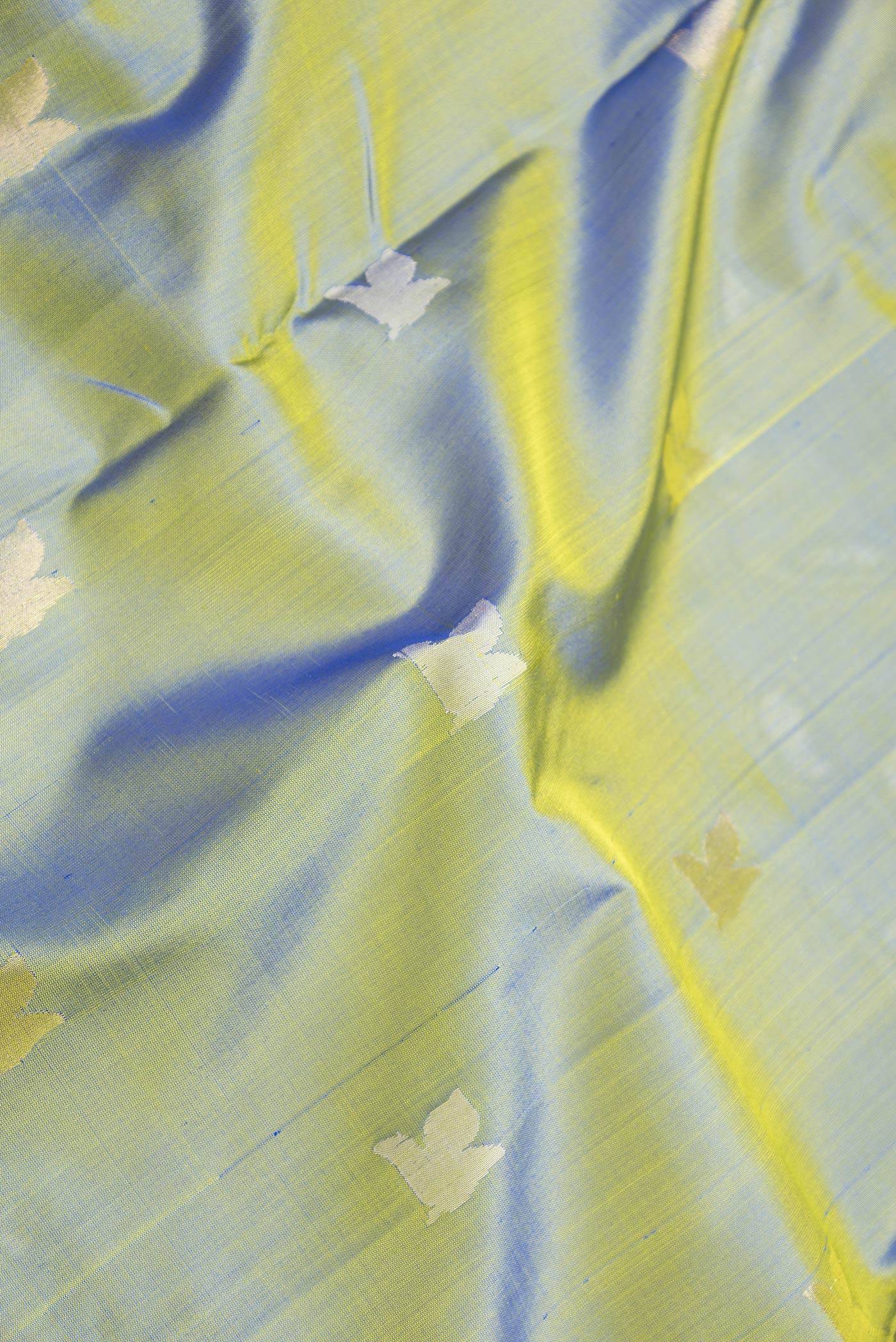 Close up of Mehandi Green Dual Tone Uppada Silk Saree with Zari And Thread Butta on the body and Fancy Border.  displaying folds