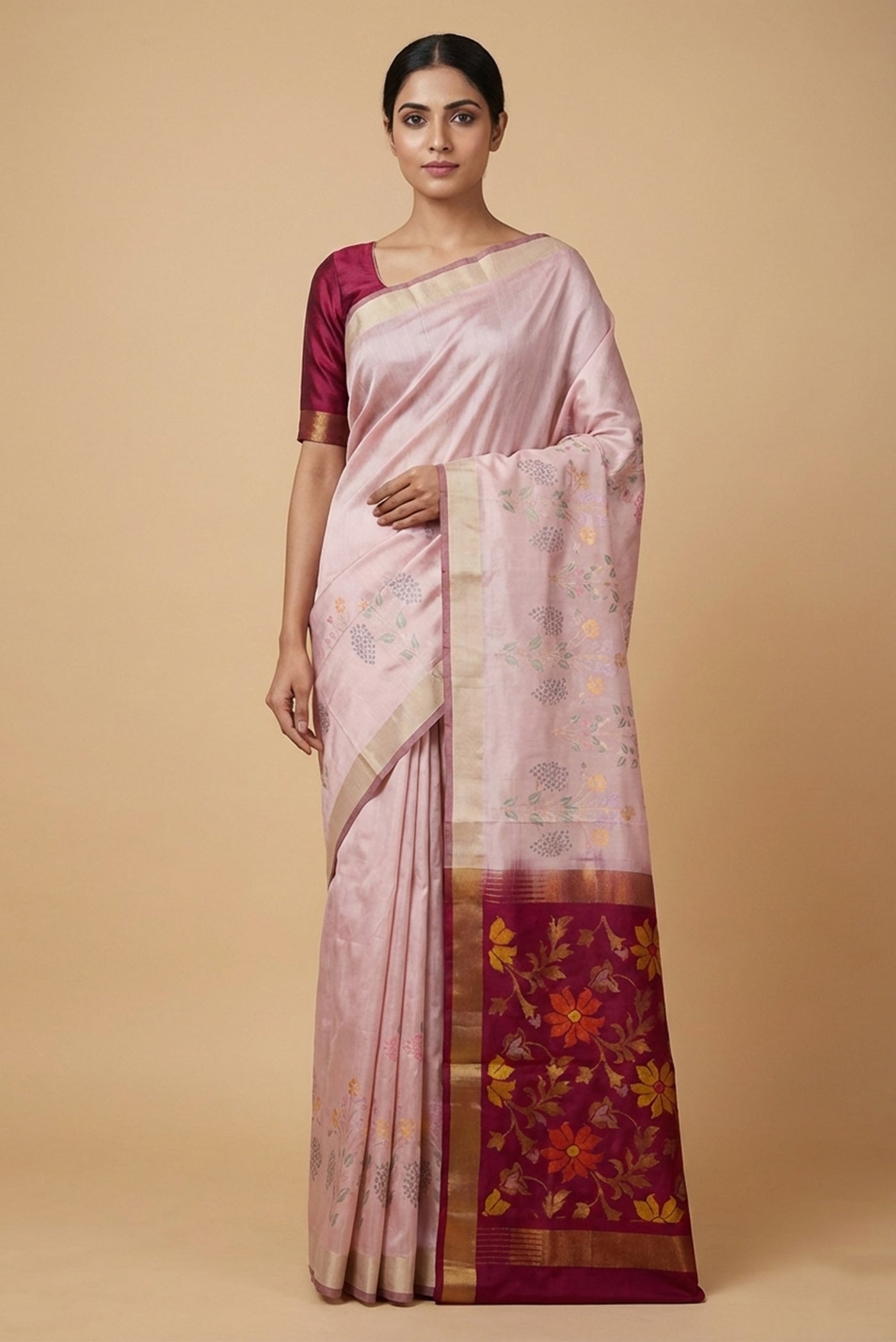 Model wearing a Pink Dual Tone Uppada Silk Saree with Zari Butta on the body and Fancy Border.