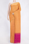 Mustard Dual Tone Kanchipuram Saree with Checked design on the body and Zari Border.  displayed on a mannequin