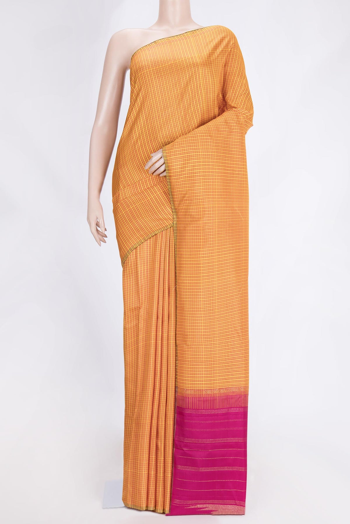 Mustard Dual Tone Kanchipuram Saree with Checked design on the body and Zari Border.  displayed on a mannequin