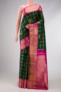 Pure Silk Pure Zari Bottle Green Dual Tone Kanjivaram Saree with Checked design on the body and Zari Border.  displayed on a mannequin