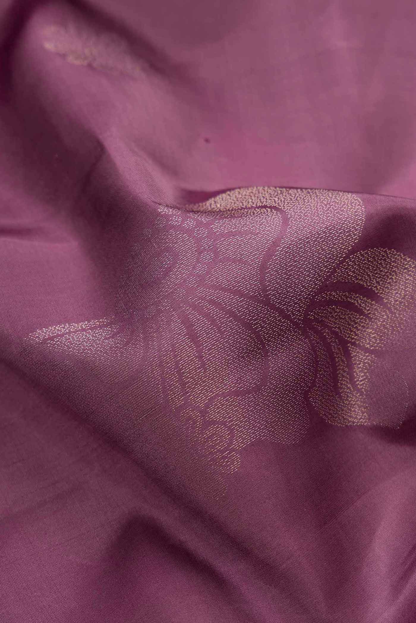 Close up of Purple Dual Tone Soft Silk Saree with Zari Butta on the body and Without Border.  displaying folds