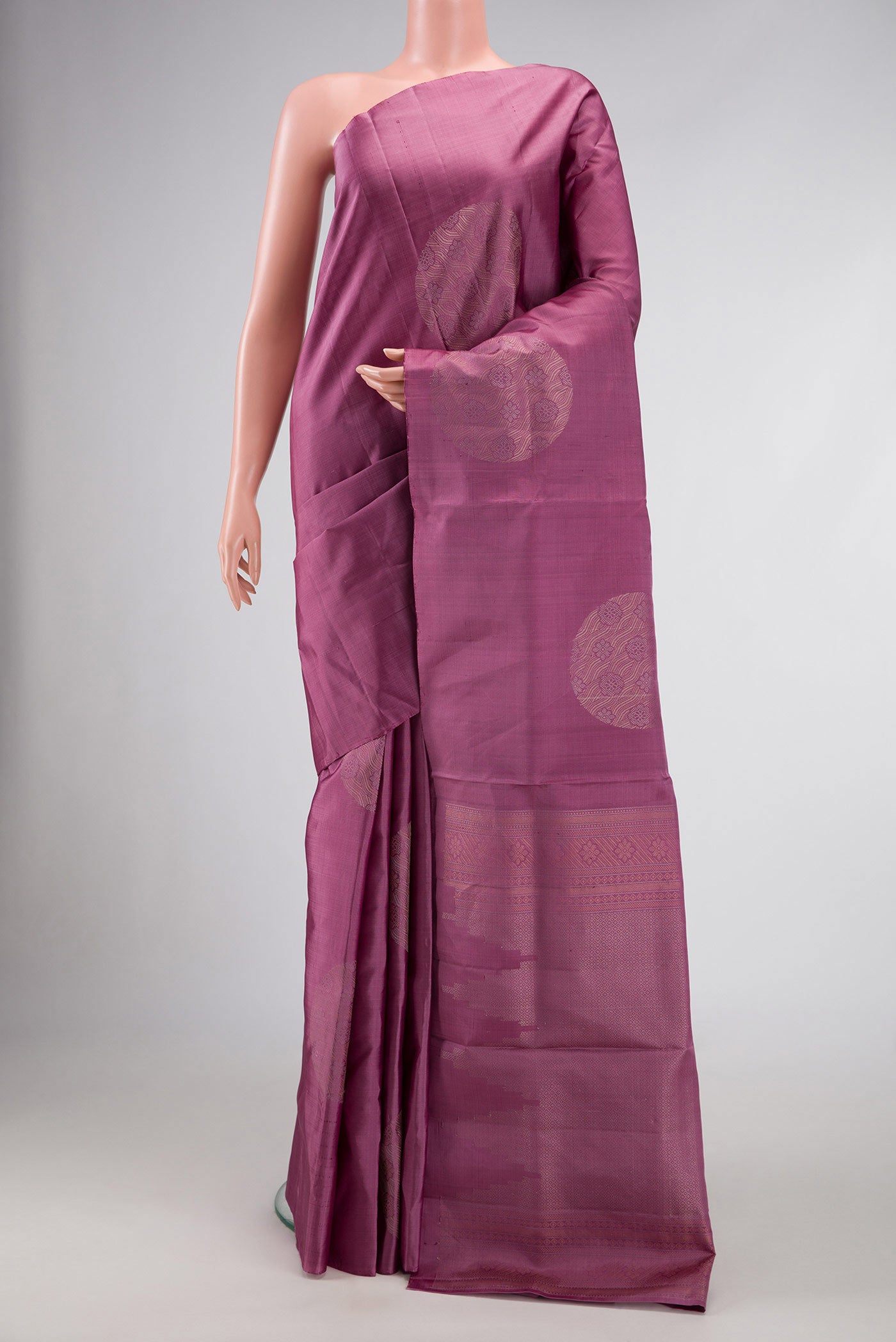 Purple Dual Tone Soft Silk Saree with Zari Butta on the body and Without Border.  displayed on a mannequin