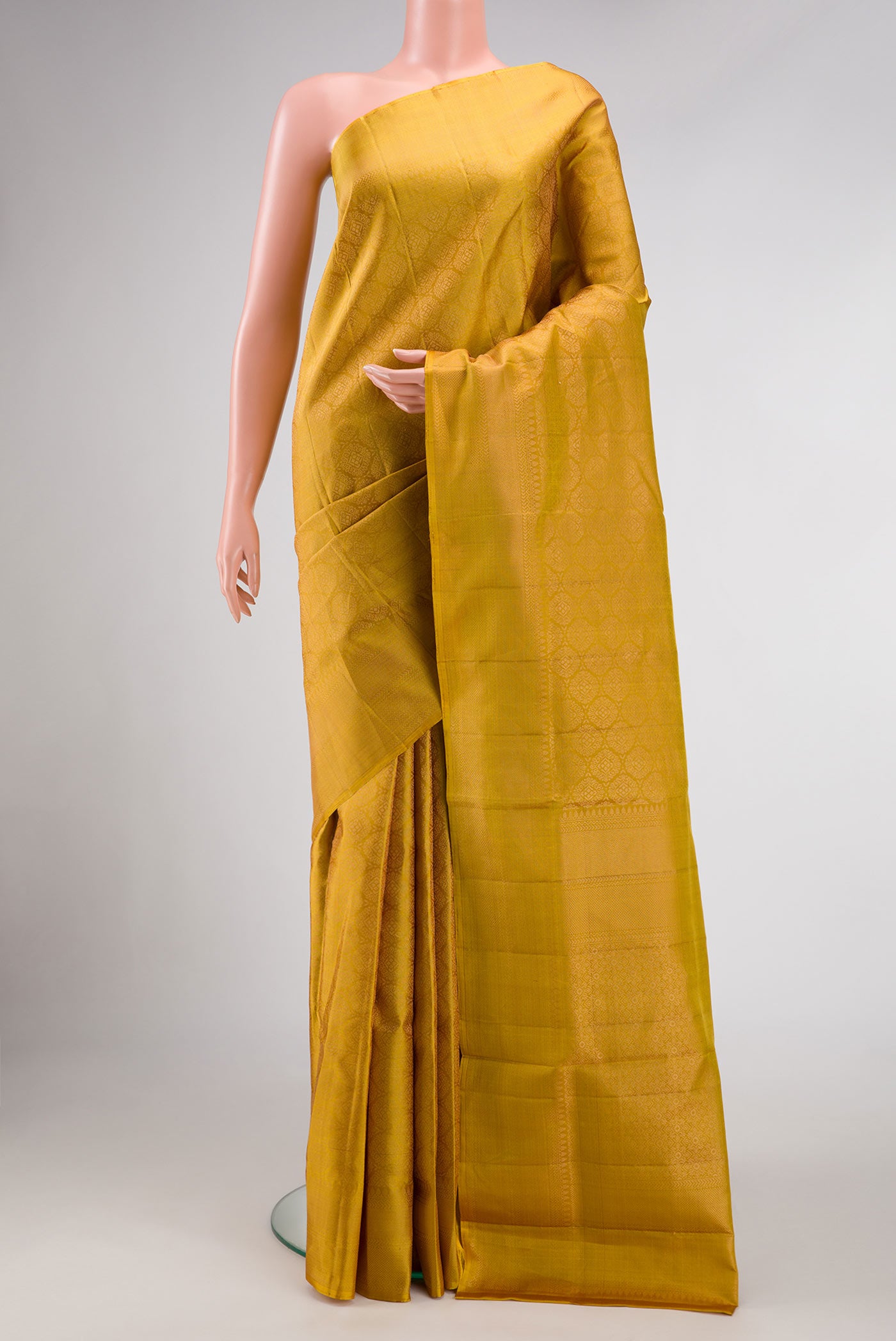 Mustard Dual Tone Soft Silk Saree with Zari Brocade on the body and Zari Border.  displayed on a mannequin