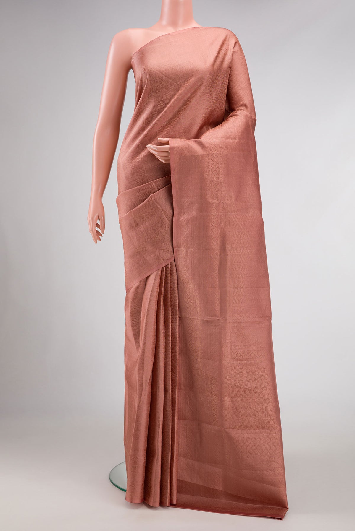 Golden Peach Dual Tone Soft Silk Saree with Zari Brocade on the body and Zari Border.  displayed on a mannequin