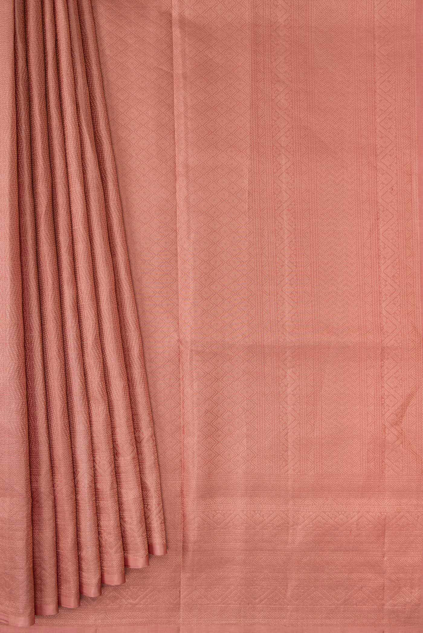 Pleats and pallu of Golden Peach Dual Tone Soft Silk Saree with Zari Brocade on the body and Zari Border. 