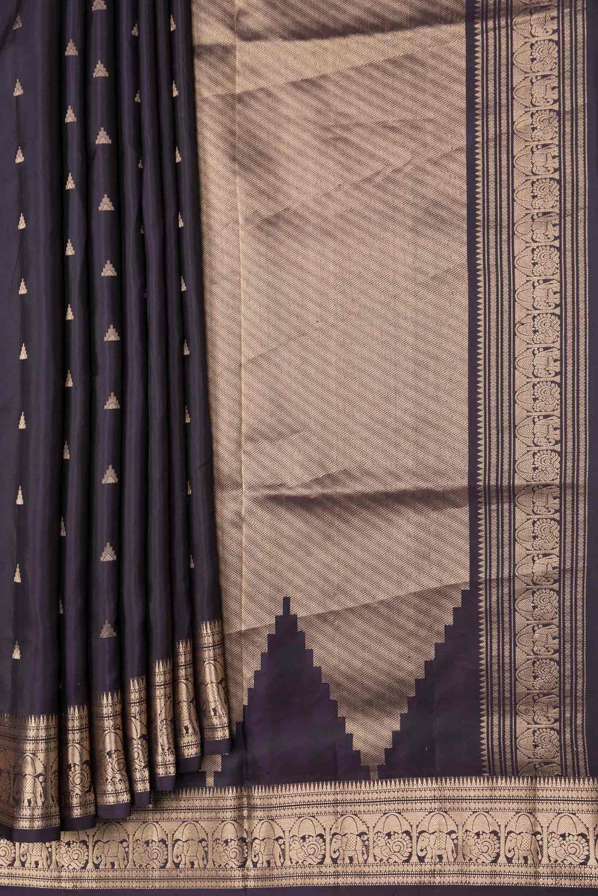 Pleats and pallu of Navy Blue Dual Tone Soft Silk Saree with Zari Butta on the body and Zari Border. 