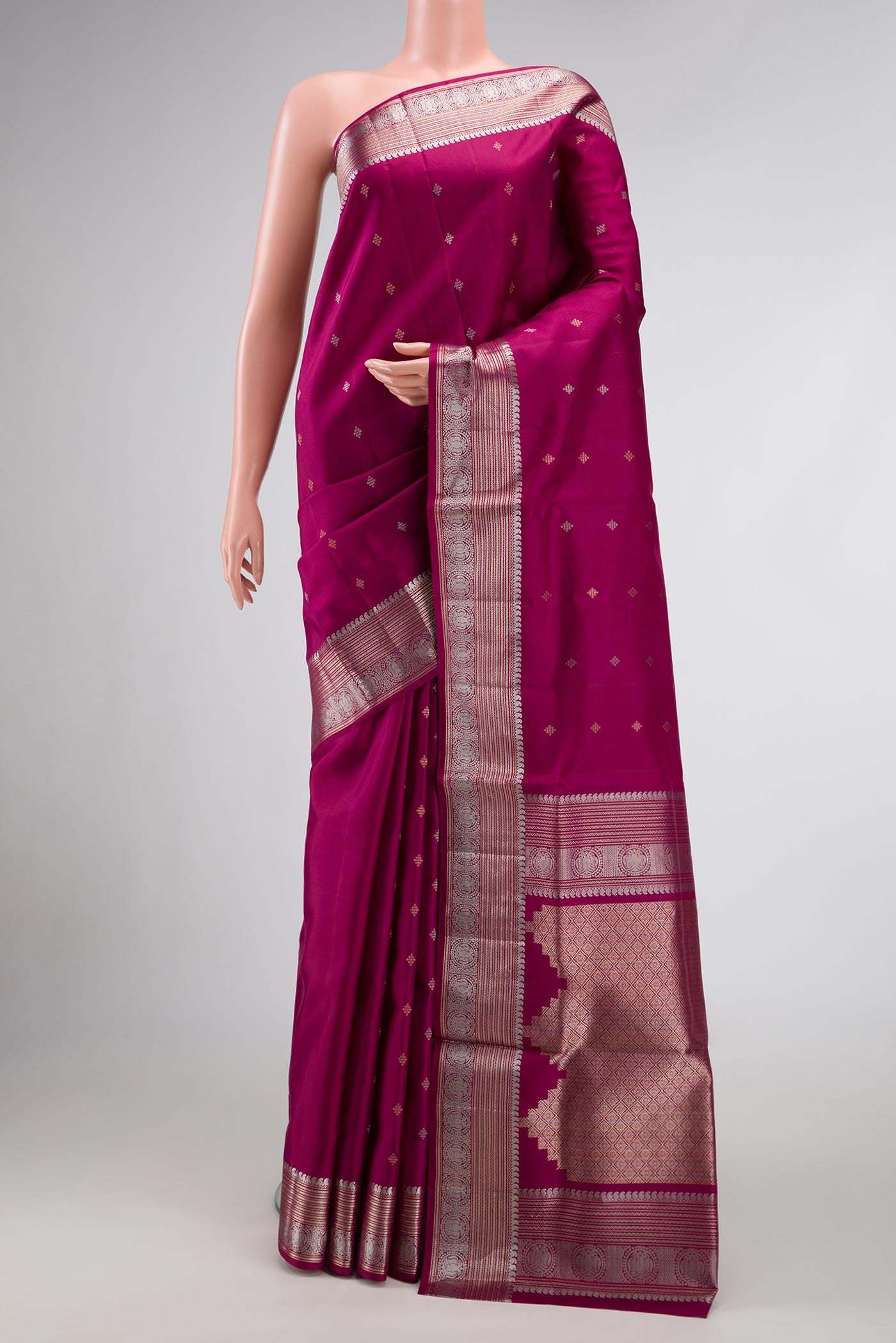 Magenta Dual Tone Soft Silk Saree with Zari Butta on the body and Zari Border.  displayed on a mannequin