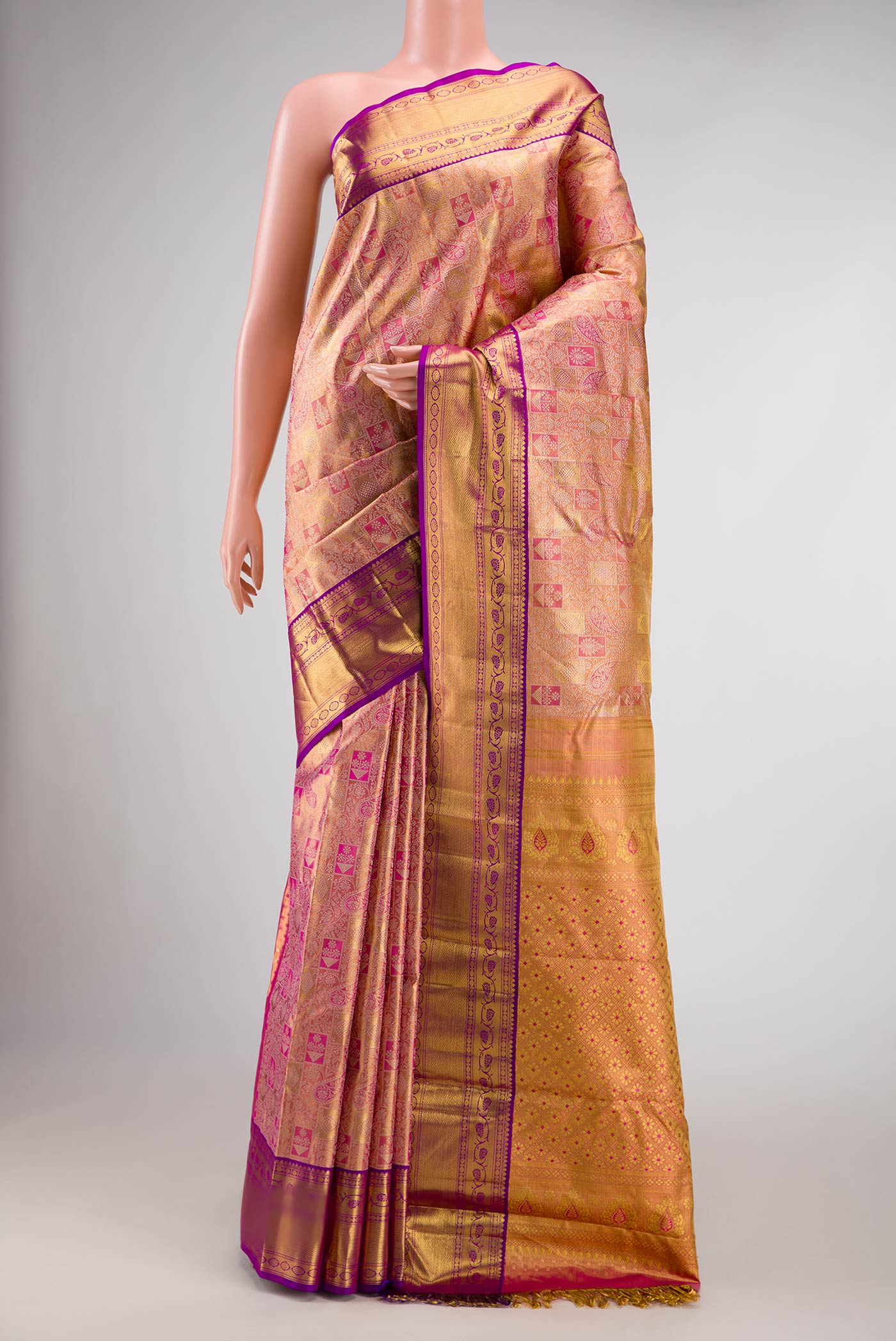 Pink Dual Tone Kanjivaram Tissue Silk Saree with Zari Brocade on the body and Zari Border.  displayed on a mannequin