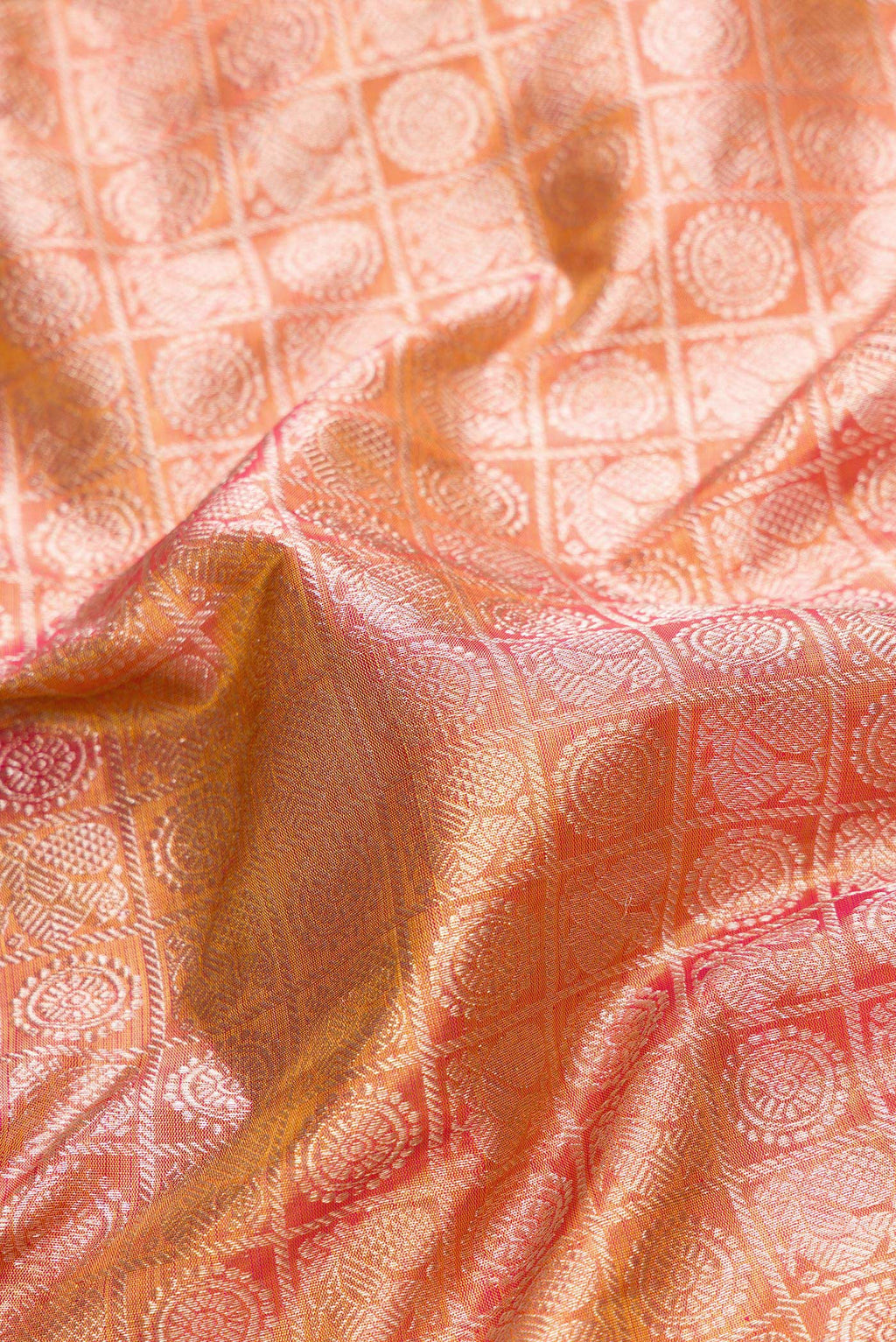 Close up of Pink Dual Tone Kanjivaram Tissue Silk Saree with Zari Brocade on the body and Zari Border.  displaying folds