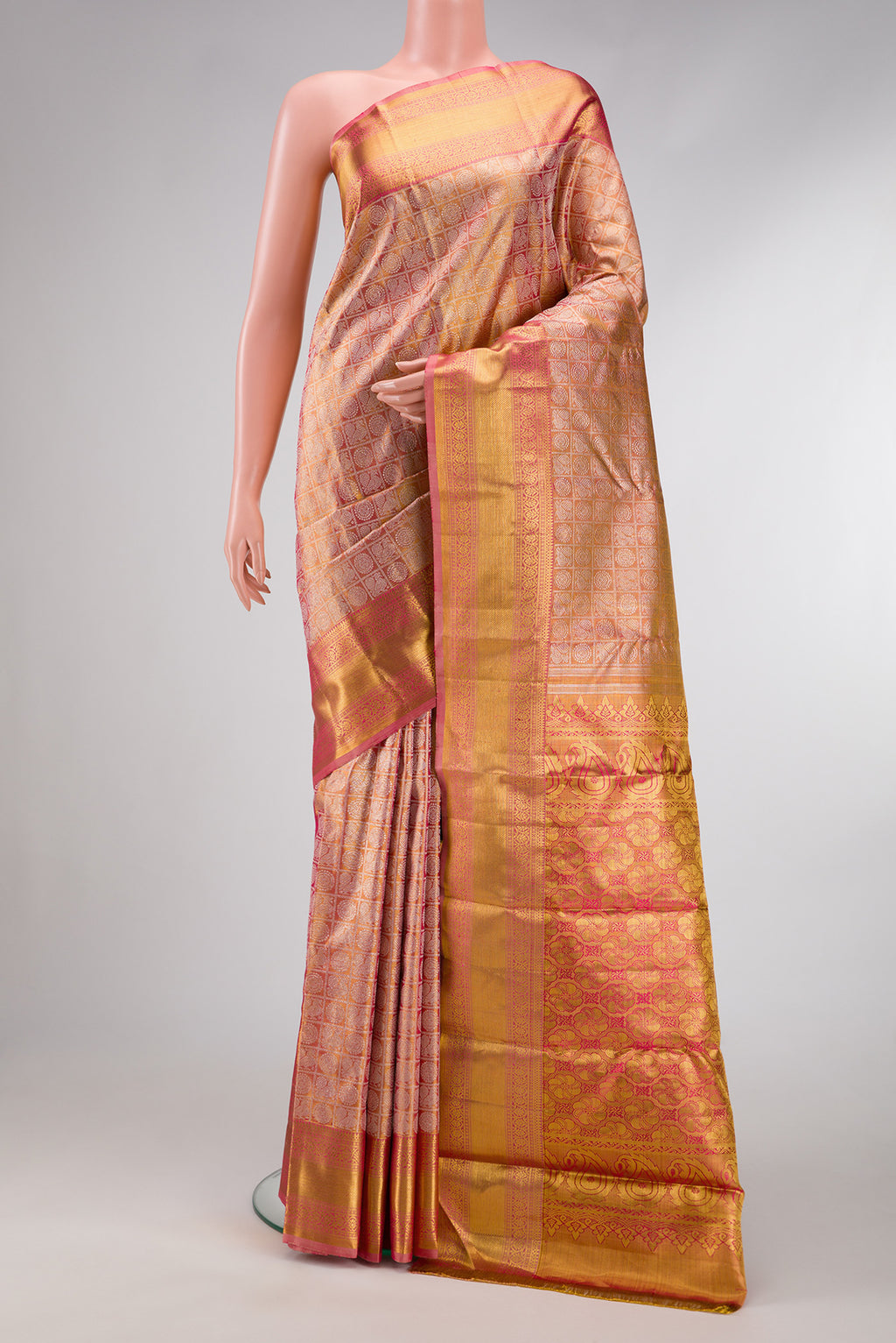 Pink Dual Tone Kanjivaram Tissue Silk Saree with Zari Brocade on the body and Zari Border.  displayed on a mannequin