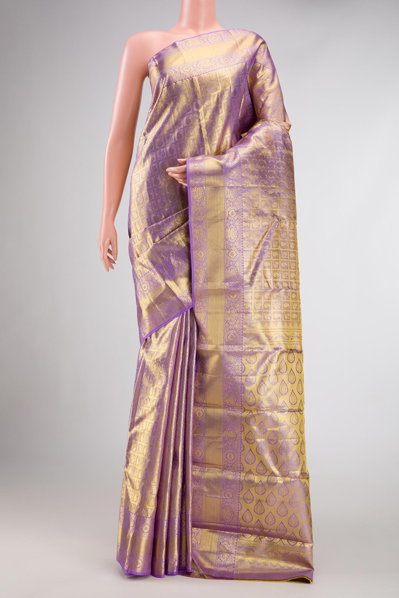 Lavender Dual Tone Kanjivaram Tissue Silk Saree with Zari Brocade on the body and Zari Border.  displayed on a mannequin