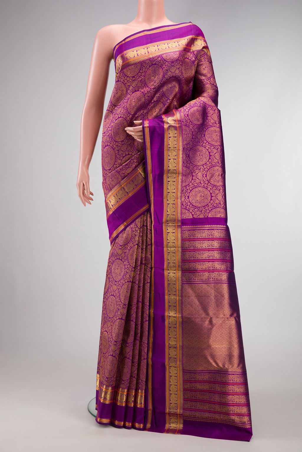 Purple Dual Tone Kanchipuram Silk Saree with Zari Brocade on the body and Zari Border.  displayed on a mannequin